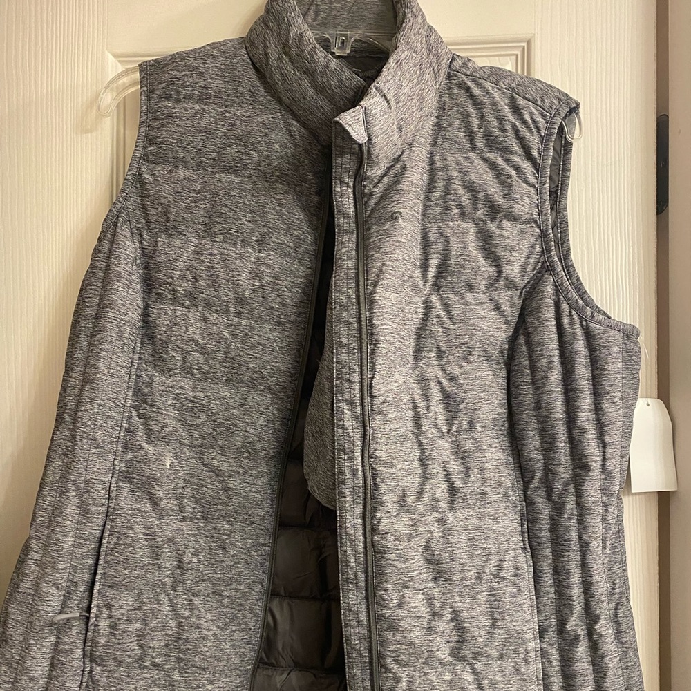 Heat keep Vest with packable, draw string bag.